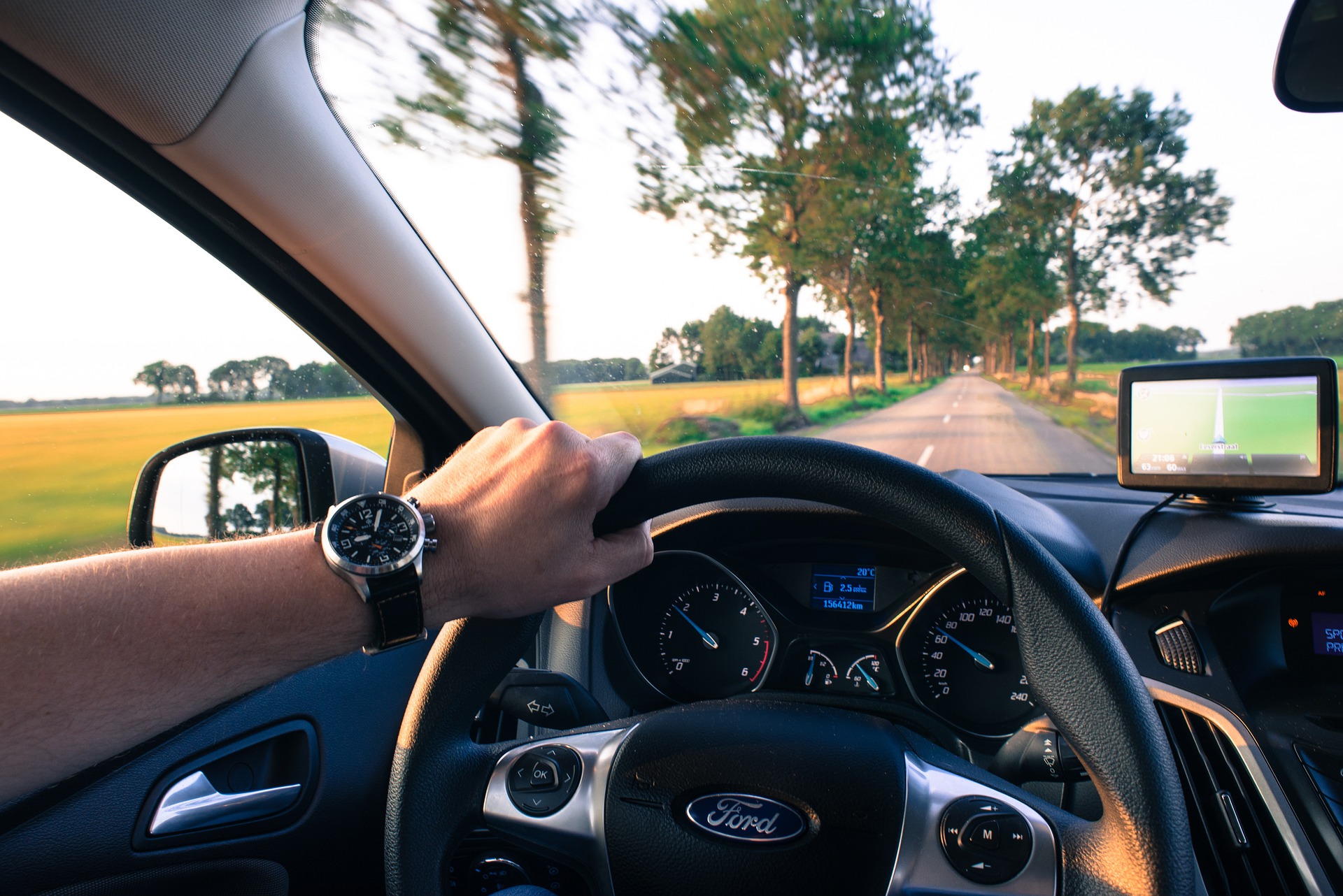 hand on a steering wheel 