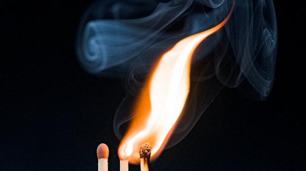 Three matches, with two alight and one unlit