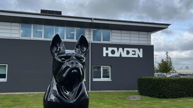 Statue of dog in front of building